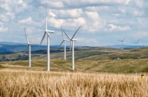 The image depicts wind mills that produce wind powered energy.